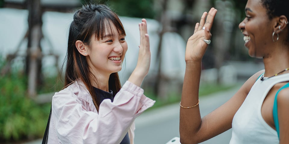 women high five